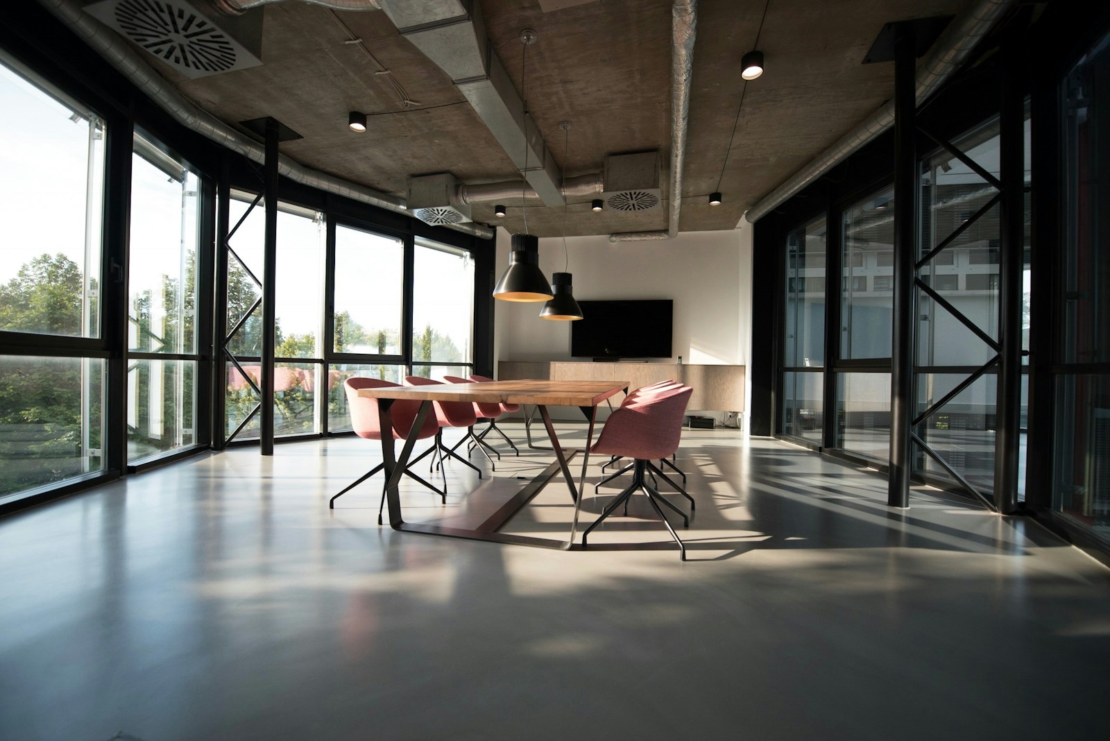 Bright commercial office with clean desks and glass partitions